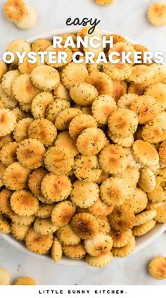 a bowl filled with ranch oyster crackers on top of a white countertop next to the words easy ranch oyster crackers