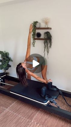 a woman is doing yoga on an exercise mat