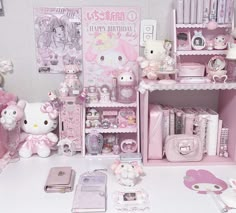 a room filled with lots of pink items and accessories on top of a white table