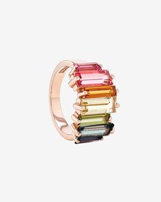 This stunning half band is the perfect accessory for any occasion. Crafted with 14-karat gold, it boasts tall baguette-cut rainbow ombre gemstones, adding a touch of sophistication to your look. Details 14k rose gold or yellow gold 7x2.5mm baguette-cut pink topaz and English blue topaz 9x2.5mm baguette-cut citrine and peridot 10x4mm baguette-cut salmon topaz, lemon quartz and green envy topaz 12mm width Ref: PR557-RBW Rainbow Stacker, Rainbow Ombre, Rainbow Gemstones, Pink Topaz, Lemon Quartz, Baguette Cut, Eternity Bands, Amalfi, Blue Topaz