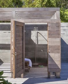 an open wooden door leading to a sauna