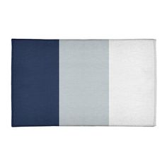 a blue and white striped towel on a white tablecloth with the colors of grey