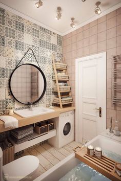 a bathroom with a washer and dryer next to a bathtub in front of a mirror