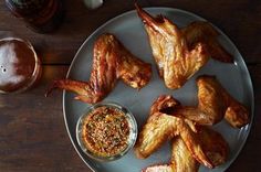 chicken wings and dipping sauce on a plate