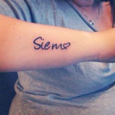 a woman with a tattoo on her arm that says sema