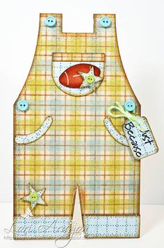 a card with an image of a baby's overalls and a fish in the pocket