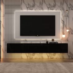 a large television mounted to the side of a wall in a room with marble walls