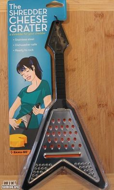 the cheese grater is shaped like a star and has a woman's image on it