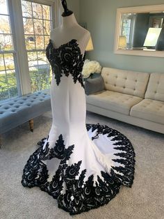 a black and white dress on display in a living room