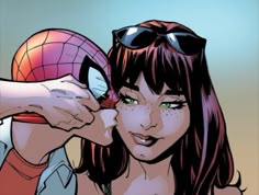 a woman with sunglasses and a spider - man mask