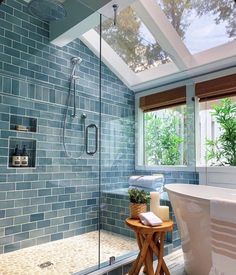 a bath room with a stand up shower and a tub