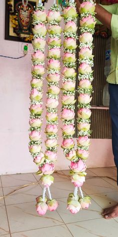 a man standing in front of a display of flowers