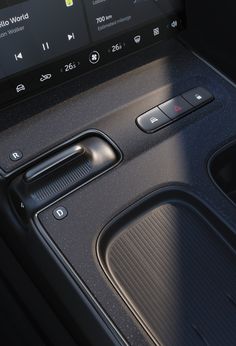 the interior of a car with buttons and controls