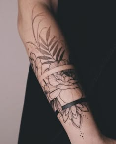 a person with a flower tattoo on their arm