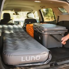 the back end of a van with an inflatable bed