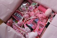 a pink box filled with lots of different items