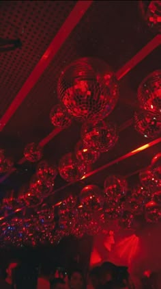 disco balls hanging from the ceiling in a club