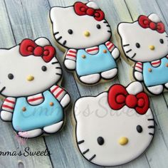 hello kitty cookies are arranged on a table