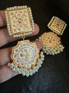 These beautiful and lightweight hand painted meena kari earrings made to take you in a journey of elegance and grace! This one is made for charmer like you with all the love from Noorzaracollection. Color : white made to order in 3-4 weeks... Note :Color, shades, texture displayed may slightly vary from the actual product due to digital image limitations. We request you to consider these minor variations. Please expect the possibility of some slight imperfections when buying handmade jewelry. If Pakistani Earrings, Jewelry Kundan, Jewelry Pakistani, Kundan Jewelry, Wearing Jewelry, Fancy Jewellery Designs, Earrings Indian, Light Weight Jewelry, Jhumki Earrings