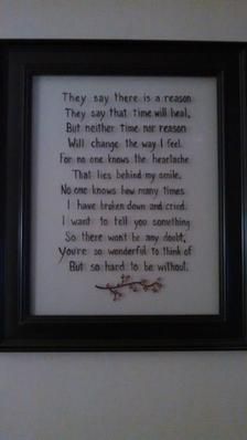 a framed poem in a black frame on the wall