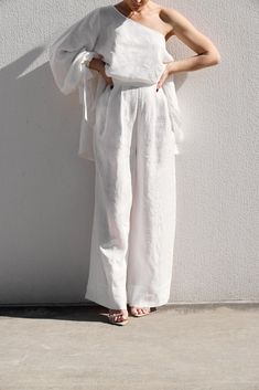 DESIGNED IN AUSTRALIA The Palazzo Pants are wide leg pants with front pleats to give fullness through the leg. They are made in a mid-weight linen, giving them a beautiful natural texture which softens with wear. They feature a structured waistband, a centre back invisible zipper closure and a wide sewn hem. SHIPPING + RETURNS: Please allow 1-3 days for delivery (depending on location) CARE INSTRUCTIONS: Cold gentle hand wash, gentle machine wash or dry clean only.FABRIC: 100% Linen SIZING: Model wears size 6. Please check the size guide for measurements. As each piece is handcrafted and made to order, please check the size guide carefully or email us if you are unsure of your size or have any questions regarding the design or fit. If you are not happy with your IL piece, an exchange or st White Palazzo Pants, White Colour, Palazzo Pants, Natural Texture, Invisible Zipper, Dry Clean Only, Pretty In Pink, Leg Pants, Wide Leg Pants