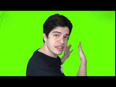 a man is making a funny face while standing in front of a green screen background