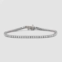 Named after women’s tennis champion Chris Evert, who lost a similar style on the 1987 US Open court, this flexible, close-set diamond bracelet comes adorned with a securely designed clasp that fluidly moves with every gesture (so it’ll stay with you forever). A perennial classic in every era, the single strand looks radiant alone for 1.8-carats of delicate sparkle and layers with other styles for a more subdued shimmer. Custom sizes are available upon request. Presented in our signature Noémie o Luxury Platinum Diamond Bracelet With Brilliant Cut, Luxury Platinum Tennis Bracelet With Single Cut Diamonds, Classic Platinum Diamond Bracelet With Single Cut Diamonds, Timeless Platinum Diamond Bracelet With Single Cut Diamonds, Platinum Tennis Bracelet With 17 Jewels For Anniversary, Classic Platinum Diamond Bracelet With Accents, Classic Platinum Diamond Bracelet, Timeless Platinum Diamond Bracelet With Accents, Timeless Tennis Bracelet With 17 Jewels