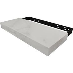 a white marble shelf with black brackets on the bottom and one piece missing from it