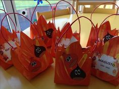 several bags with cartoon characters on them sitting on a table in front of a window