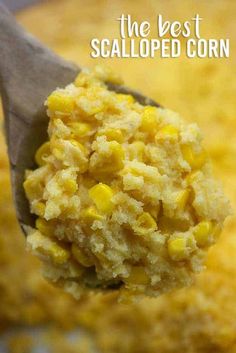 a spoon filled with corn on top of a casserole