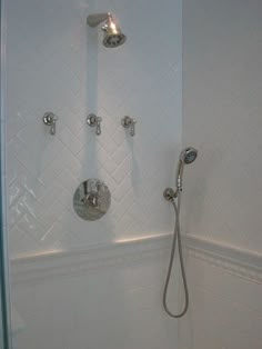 the shower head and handset are connected to the faucet