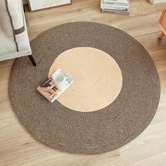 a round rug with a magazine on it