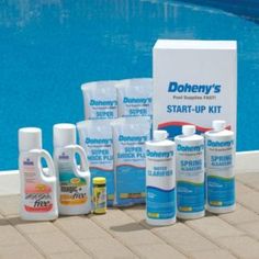 bottles and containers of cleaning products next to a swimming pool