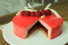 a red velvet cake with raspberries on top