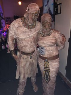 two people in costumes standing next to each other