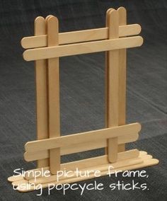 a small wooden easel on a black background