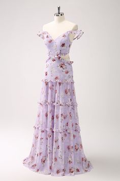 a dress on a mannequin with flowers in the front and back, all over it