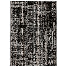 an area rug with black and white stripes on it, in the shape of squares