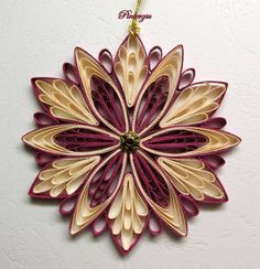 an ornament made out of folded paper