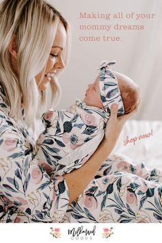 a woman holding a baby in her arms with the caption making all of your mommy dreams come true