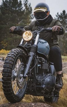 a man riding on the back of a motorcycle