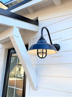 an outdoor light on the side of a house