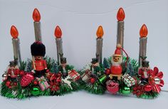 two christmas decorations with candles and nutcrackers