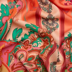 an orange, pink and green paisley print fabric