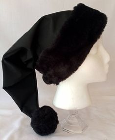 Please read to the very end for shop language and product description Unquestionably one of our most unusual and most popular hats. This solid black Christmas hat is made from black breathable cotton, lined with cotton, and features our exclusive black fur brim/flocking and pom pom, this hat is certainly a conversation piece. It is certainly a rarity to see a solid black Christmas hat, surely everyone will want to know where you got it from. (The Black Brim/flocking and pom pom can be substitute Black Beanie Costume Hat For Winter, Black Cap For Winter Costume, Black Beanie For Winter - Costume Hat, Merry Gothmas, Black Santa Hat, Black Christmas Tree Decorations, Santa Hat Png, Black Christmas Decorations, Winter Angel