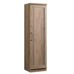 a tall wooden cabinet sitting on top of a white wall