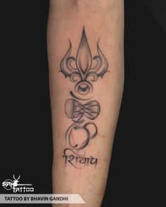 a tattoo on the leg of a person with an omen symbol in black ink