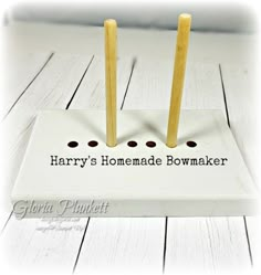 there are two matches on top of a white box that says harry's homemade bowmaker