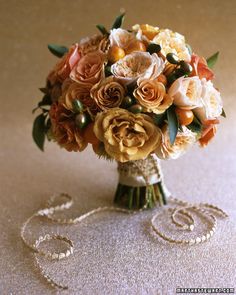 a bridal bouquet with pearls and flowers