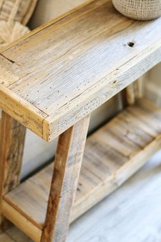 a wooden table sitting on top of a hard wood floor